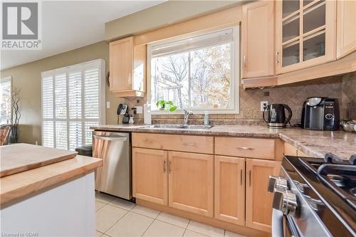 Kitchen featuring a healthy amount of sunlight, sink, light brown cabinets, and stainless steel appliances - 613 Black Street, Fergus, ON - Indoor Photo Showing Kitchen With Double Sink