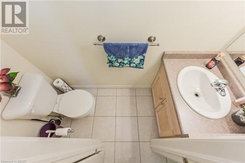 Bathroom with tile patterned floors, vanity, and toilet - 613 Black Street, Fergus, ON - Indoor Photo Showing Bathroom