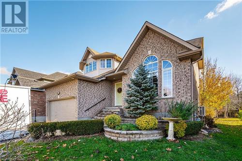 View of front property featuring a front yard and a garage - 613 Black Street, Fergus, ON - Outdoor