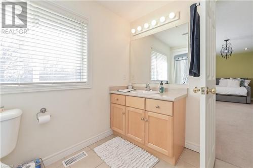 Bathroom featuring toilet, vanity, and tile patterned floors - 613 Black Street, Fergus, ON - Indoor Photo Showing Bathroom