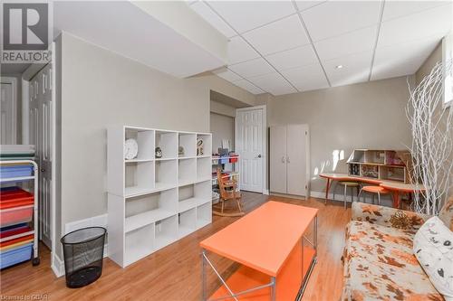 Living room with wood-type flooring and a paneled ceiling - 613 Black Street, Fergus, ON - Indoor