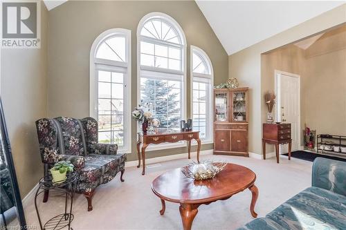 Living area featuring carpet and high vaulted ceiling - 613 Black Street, Fergus, ON - Indoor Photo Showing Living Room