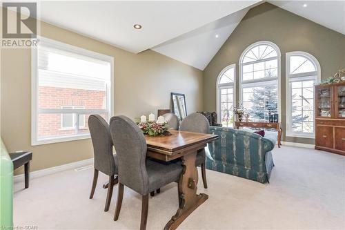 Dining space with a wealth of natural light, light carpet, and lofted ceiling - 613 Black Street, Fergus, ON - Indoor Photo Showing Dining Room