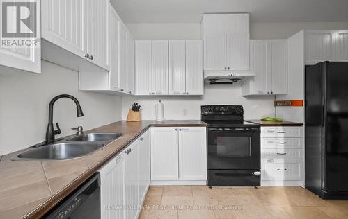 1108 Sandy Hook Road, Kawartha Lakes, ON - Indoor Photo Showing Kitchen With Double Sink