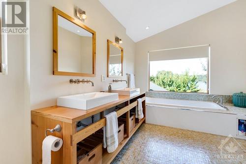 Primary bedroom  ensuite overlooks bay - 9868 County Road 42 Road, Westport, ON - Indoor Photo Showing Bathroom