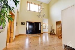 Grand front foyer soaring ceiling and elegant chandelier - 