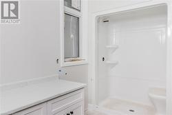 Bathroom featuring vanity and walk in shower - 