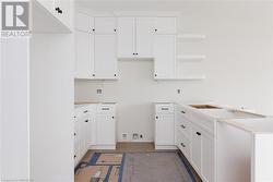 Kitchen with white cabinetry - 