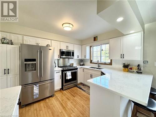 Kitchen Features Quartz Counter Tops and Stainless Appliances - 34 Archibald Place, Southampton, ON - Indoor Photo Showing Kitchen