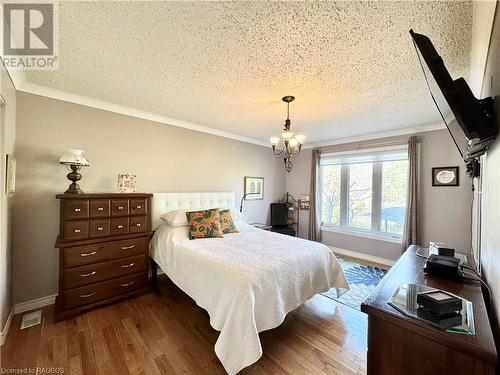 Primary Bedroom with Hardwood Floors - 34 Archibald Place, Southampton, ON - Indoor Photo Showing Bedroom