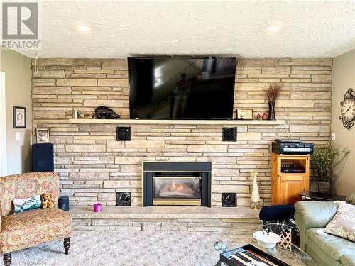 Lower Level Family Room with Gas Fireplace - 34 Archibald Place, Southampton, ON - Indoor Photo Showing Living Room With Fireplace