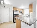 1011 - 2020 Mcnicoll Avenue, Toronto, ON  - Indoor Photo Showing Kitchen With Double Sink 