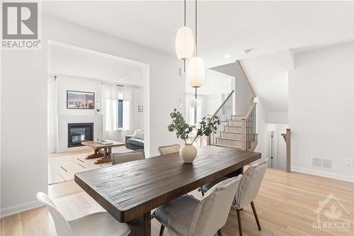 30 Conch Way, Ottawa, ON - Indoor Photo Showing Dining Room With Fireplace