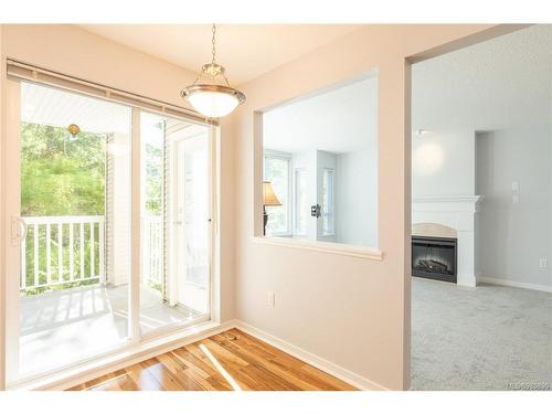 207-5660 Edgewater Lane, Nanaimo, BC - Indoor Photo Showing Other Room With Fireplace