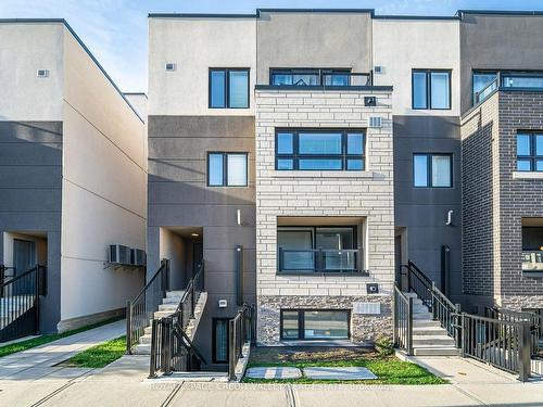 801-1133 Cooke Blvd, Burlington, ON - Outdoor With Fireplace With Facade