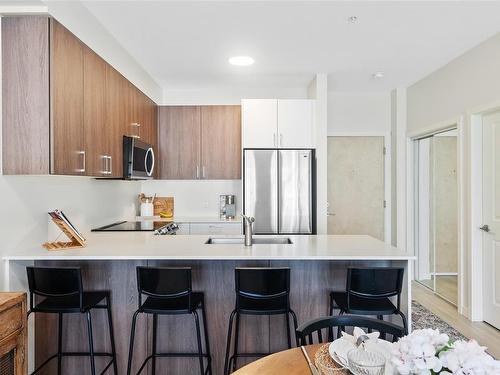 404-810 Orono Ave, Langford, BC - Indoor Photo Showing Kitchen With Stainless Steel Kitchen With Upgraded Kitchen