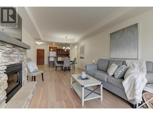 Living room to Dining - 2770 Auburn Road Unit# 201, West Kelowna, BC - Indoor Photo Showing Living Room With Fireplace