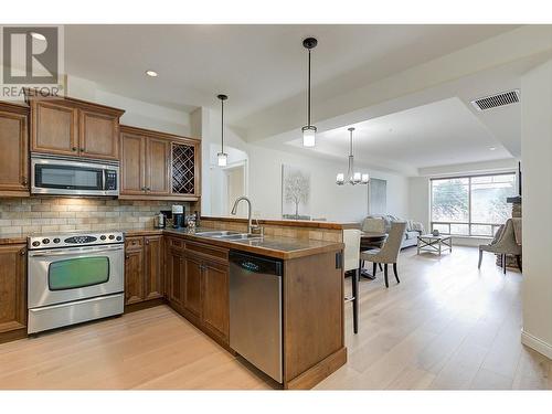 Open concept living - kitchen to dining and living room - 2770 Auburn Road Unit# 201, West Kelowna, BC - Indoor Photo Showing Kitchen With Double Sink