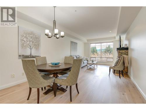 Dining to living room - new hardwood flooring and freshly painted - 2770 Auburn Road Unit# 201, West Kelowna, BC - Indoor Photo Showing Dining Room