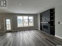 5218 E Green Crescent, Regina, SK  - Indoor Photo Showing Living Room With Fireplace 