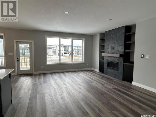 5218 E Green Crescent, Regina, SK - Indoor Photo Showing Living Room With Fireplace