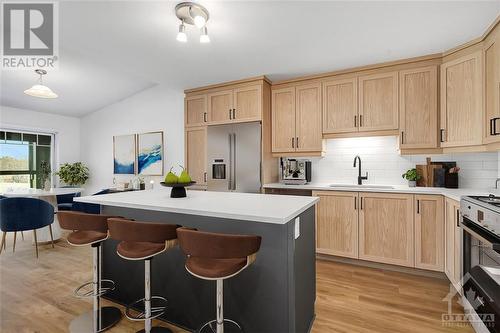 Virtually Staged - 350 Montee Outaouais Street Unit#603, Rockland, ON - Indoor Photo Showing Kitchen With Upgraded Kitchen