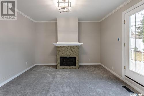 1145 Bogue Avenue, Moose Jaw, SK - Indoor Photo Showing Other Room With Fireplace