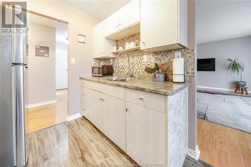 3936 Wyandotte Street East Unit# 709, Windsor, ON - Indoor Photo Showing Kitchen With Double Sink