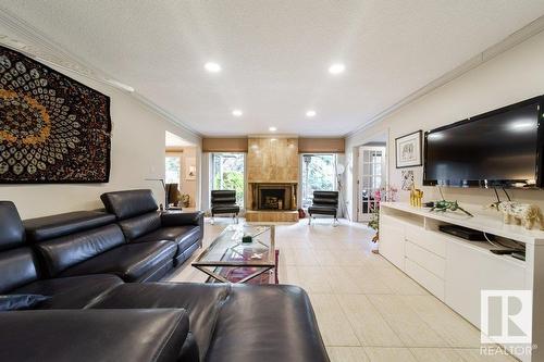 #4 14812 45 Av Nw, Edmonton, AB - Indoor Photo Showing Living Room With Fireplace