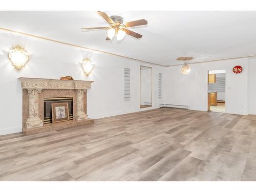 12410 90A Avenue, Surrey, BC - Indoor Photo Showing Living Room With Fireplace