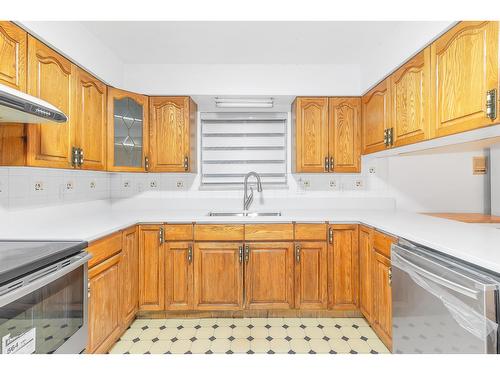 12410 90A Avenue, Surrey, BC - Indoor Photo Showing Kitchen With Double Sink