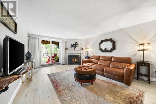 15 - 2155 Duncaster Drive, Burlington, ON - Indoor Photo Showing Living Room With Fireplace