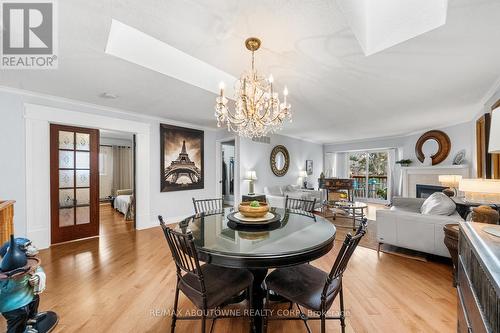 15 - 2155 Duncaster Drive, Burlington, ON - Indoor Photo Showing Dining Room With Fireplace