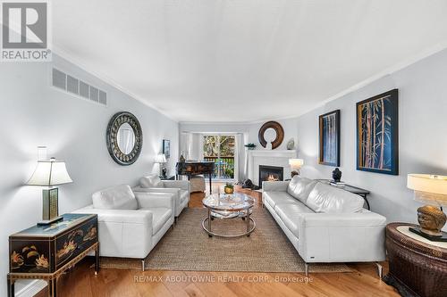 15 - 2155 Duncaster Drive, Burlington, ON - Indoor Photo Showing Living Room With Fireplace