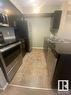 #324 3315 James Mowatt Tr Sw, Edmonton, AB  - Indoor Photo Showing Kitchen With Double Sink 