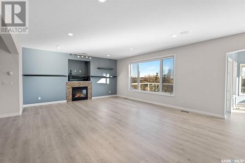 Brand Acreage, Corman Park Rm No. 344, SK - Indoor Photo Showing Living Room With Fireplace