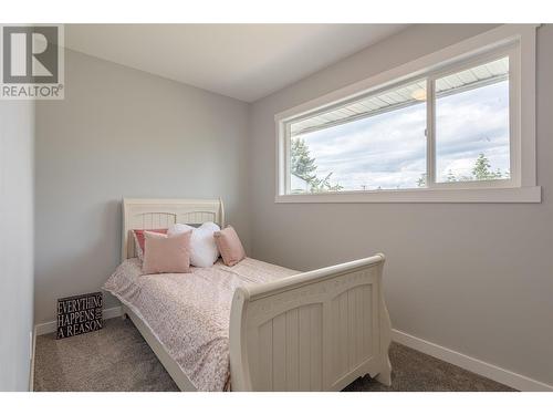 Second upstairs bedroom with large window - 3600 13 Street, Vernon, BC 