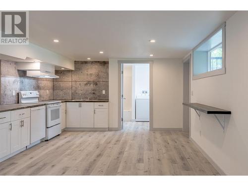 Room to add a dining table or eat at the breakfast bar at the window - 3600 13 Street, Vernon, BC 