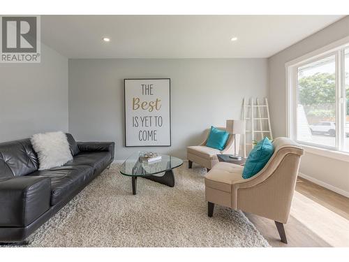 Living room area with picture window and loads of natural light - 3600 13 Street, Vernon, BC 