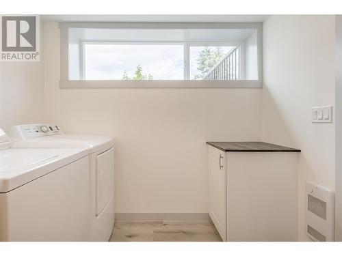 In suite laundry with NEW washer and dryer as well as a handy folding counter - 3600 13 Street, Vernon, BC 