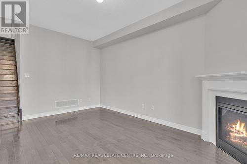 466 Cedric Terrace, Milton, ON - Indoor Photo Showing Other Room With Fireplace