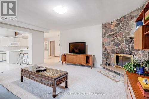 18 Burnt Log Crescent, Toronto, ON - Indoor Photo Showing Living Room With Fireplace