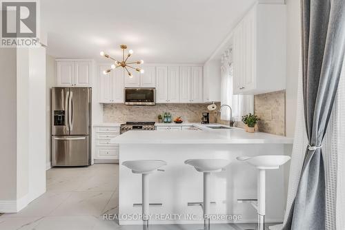 32 - 4156 Fieldgate Drive, Mississauga, ON - Indoor Photo Showing Kitchen With Stainless Steel Kitchen With Upgraded Kitchen