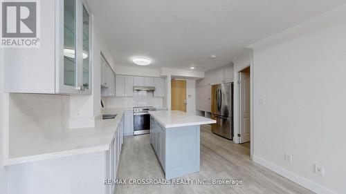 705 - 7373 Kennedy Road, Markham, ON - Indoor Photo Showing Kitchen With Stainless Steel Kitchen With Upgraded Kitchen