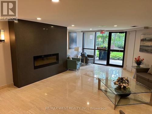 1205 - 95 La Rose Avenue, Toronto, ON - Indoor Photo Showing Living Room With Fireplace