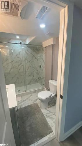 Bathroom with toilet, a tile shower, and vanity - 896 John Street Street Unit# B2, Innisfil, ON - Indoor Photo Showing Bathroom