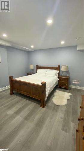 Bedroom with hardwood / wood-style flooring - 896 John Street Street Unit# B2, Innisfil, ON - Indoor