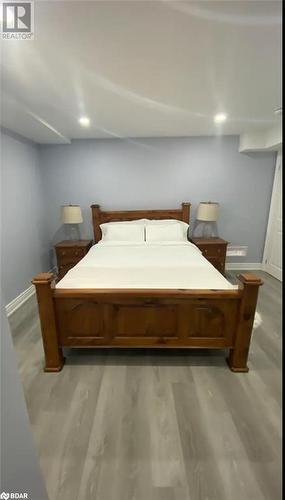 Bedroom featuring light wood-type flooring - 896 John Street Street Unit# B2, Innisfil, ON - Indoor