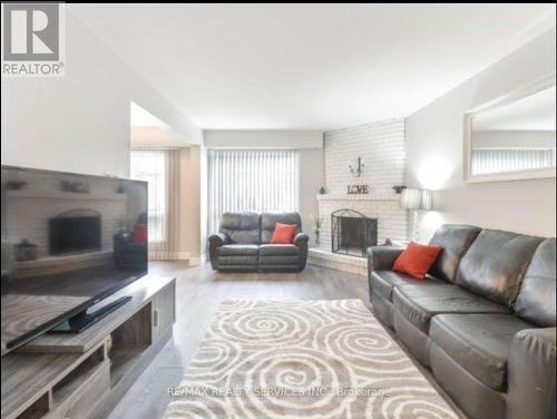 Main - 19 Simmons Boulevard, Brampton, ON - Indoor Photo Showing Living Room With Fireplace