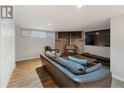 1698 Gillard Drive, Kelowna, BC - Indoor Photo Showing Basement With Fireplace